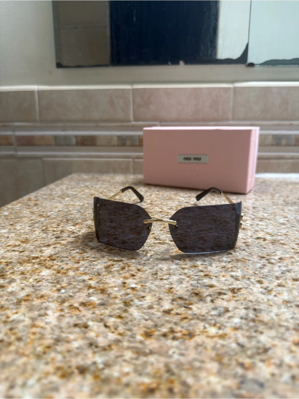 Miu Miu Rimless Sunglasses with Black Lenses and Gold Temples